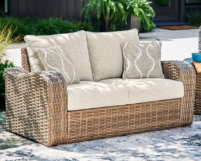 Sandy Bloom Outdoor Ottoman with Cushion